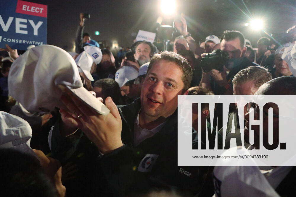 Canadian Conservative Party leader Andrew Scheer autographs hats with ...