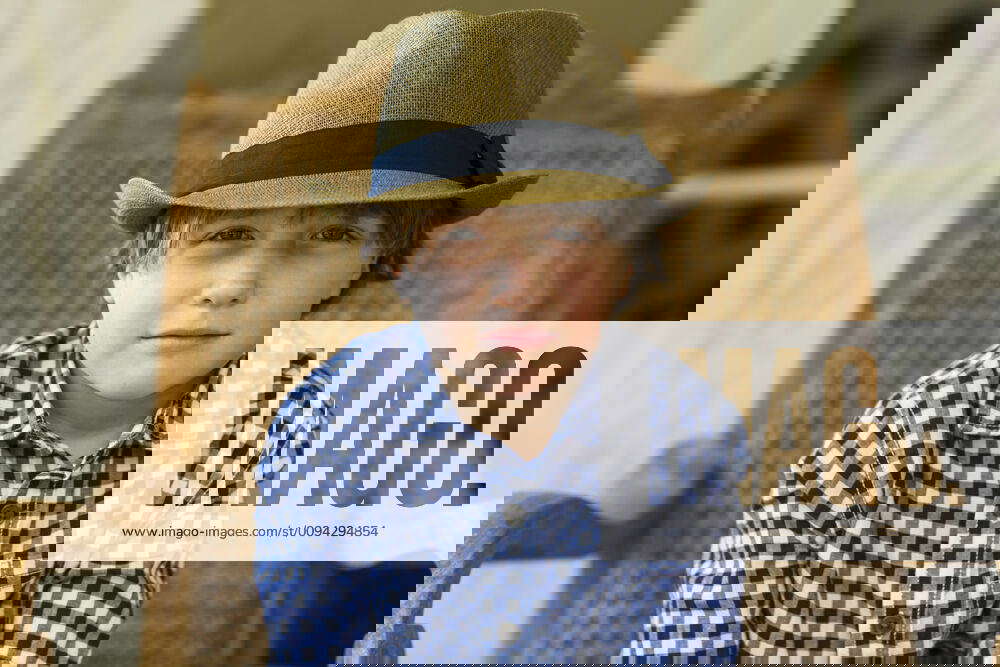 Portrait of 6 year old boy sitting in wicker chair portrait of 6 year