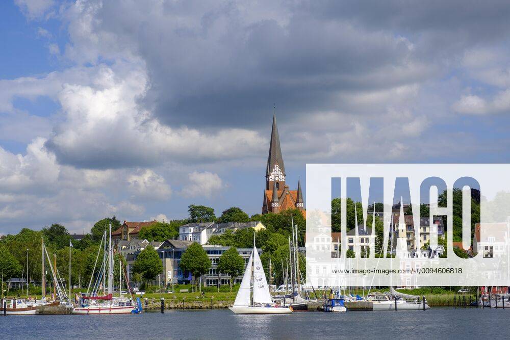 Sailing ships in the harbour of Flensburg, with church St Jürgen
