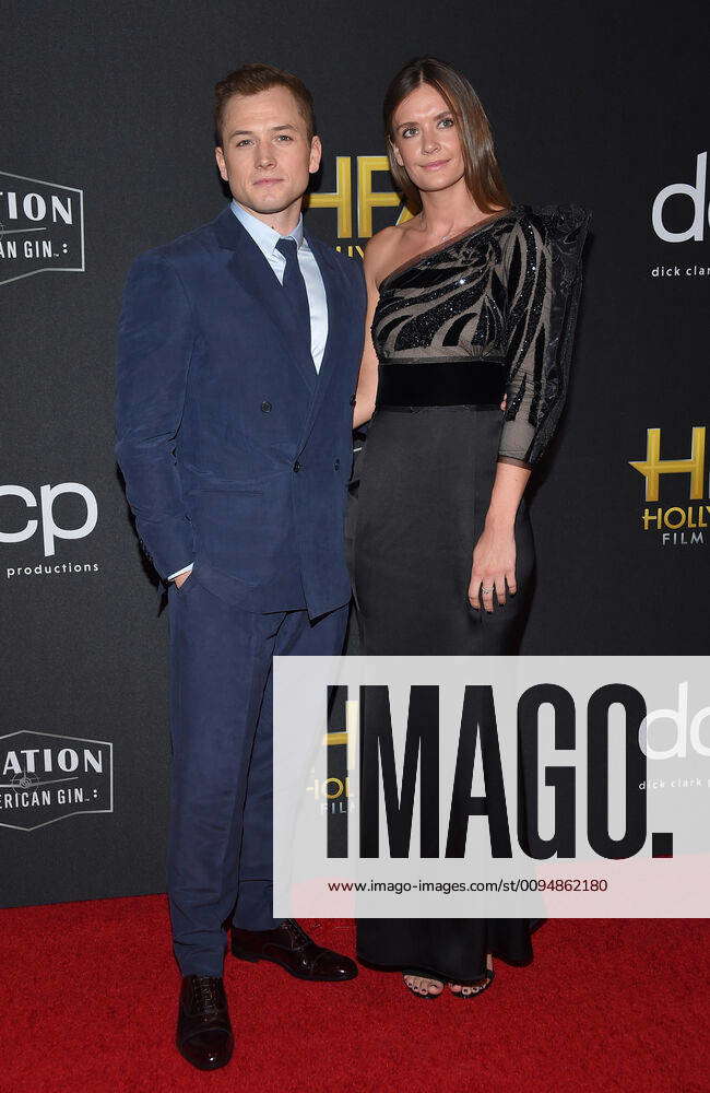 Taron Egerton and Emily Thomas arriving at the 23rd Annual Hollywood ...