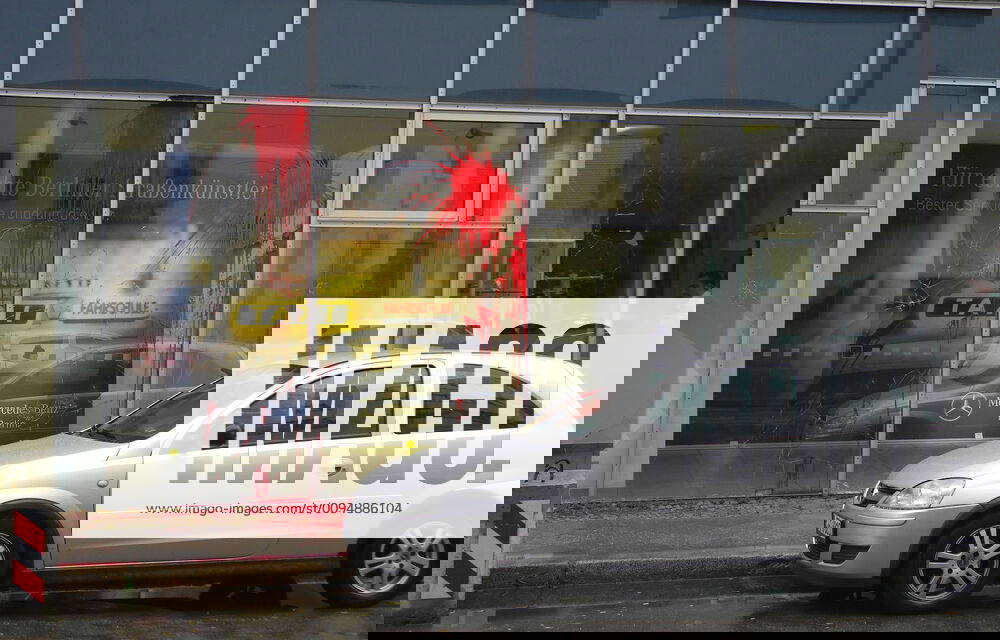 Paint bags and stones on the glass facade of a car dealership in