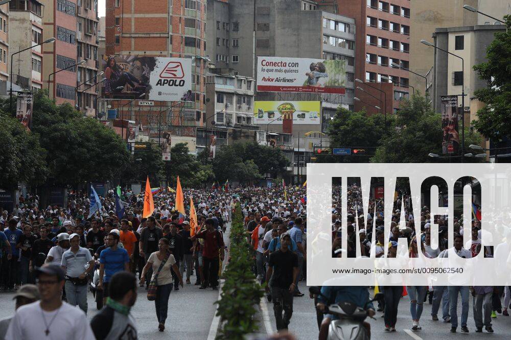 Opponents of the government of Nicolas Maduro march in Caracas ...