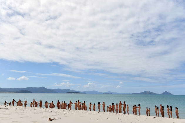 SPENCER TUNICK WHITEHAVEN BEACH, *File* People posing nude on a beach on  Haslewood Island, part of