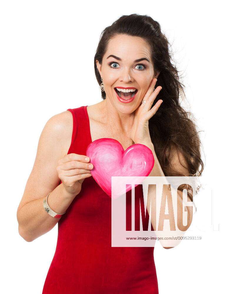 A Beautiful Happy Surprised Woman Holding A Red Love Heart Isolated On