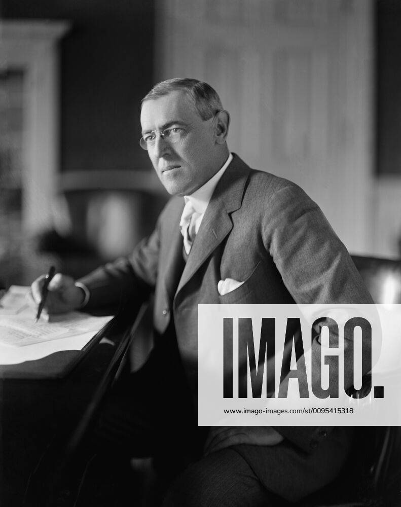 U.S. President Woodrow Wilson sitting at Desk in White House Oval
