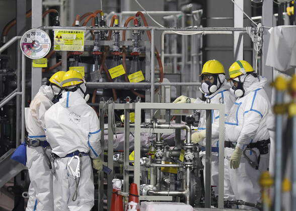 January 22, 2020, Okuma, Fukushima, Japan: Fully covered workers check ...