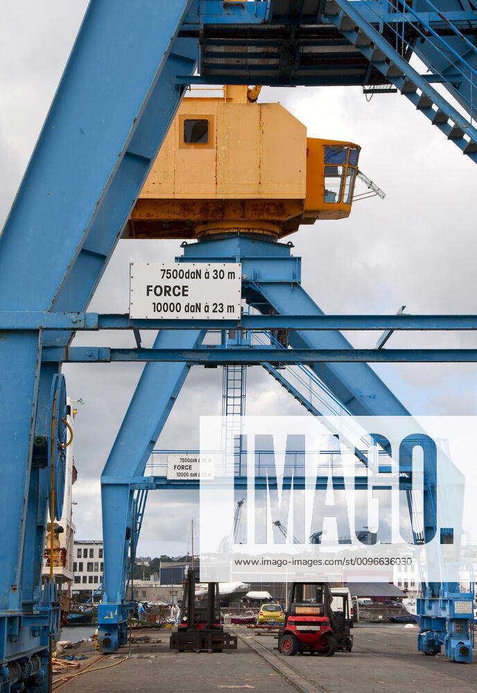 Port cranes on a dock in the port of Brest (France) port cranes on a ...