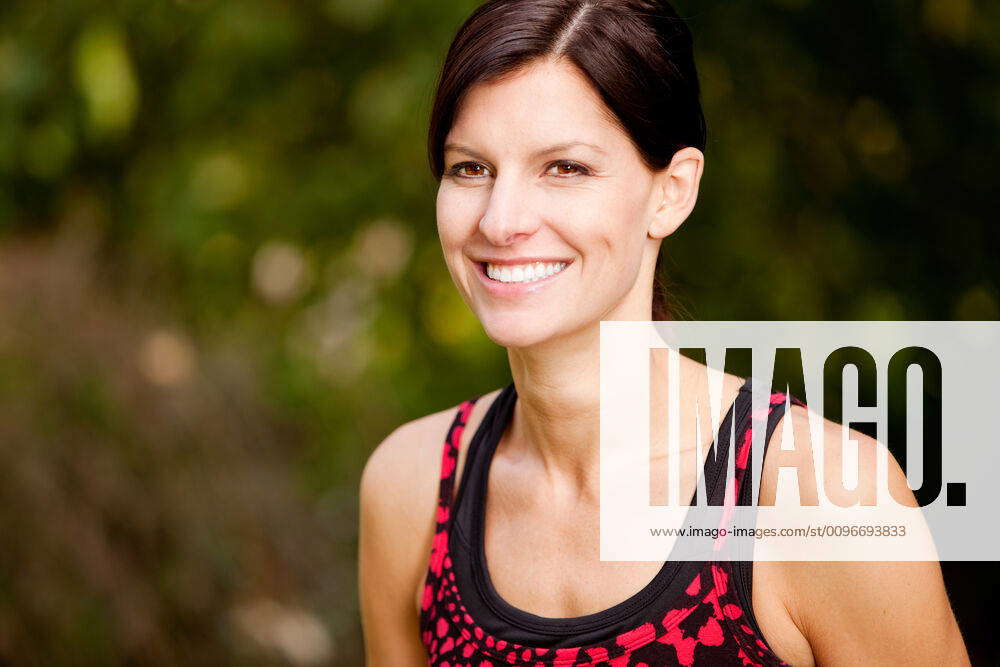 Fitness A happy fitness woman in the park - lifestyle portrait