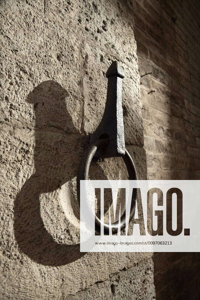 Metal hitching post. Metal hitching post on stone wall