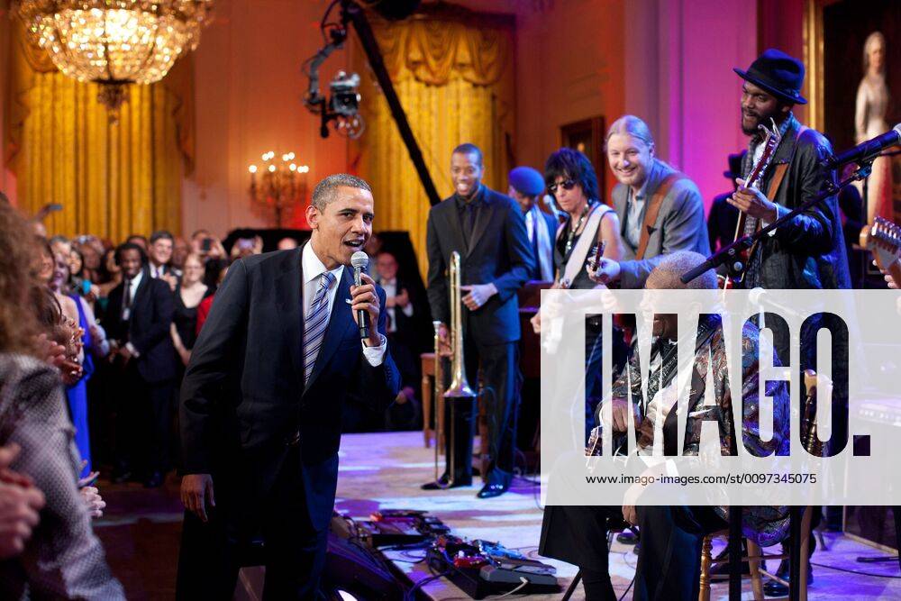 President Barack Obama joins in singing Sweet Home Chicago . He joins