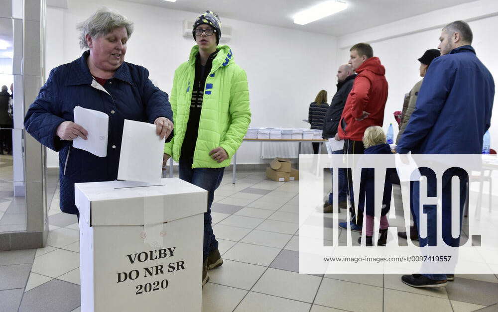 A woman, left, votes during the Slovak general election in Kuty ...