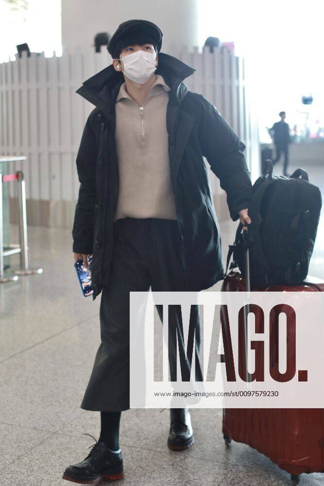 Chinese actor and singer Tong Zhuo arrives at a Beijing airport before