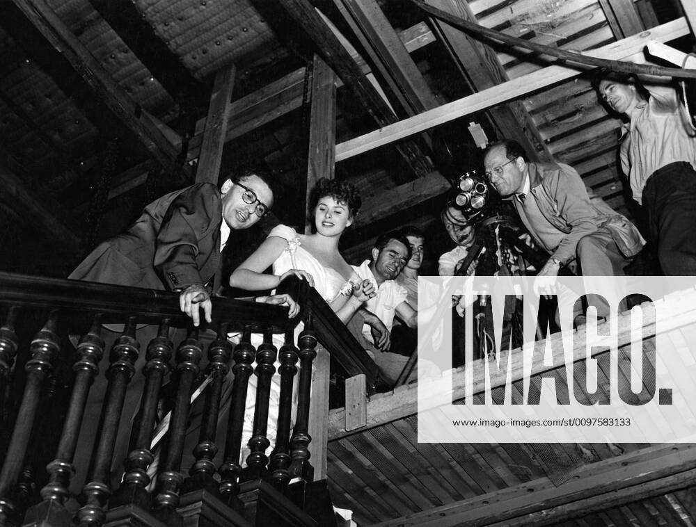 GASLIGHT, director George Cukor (left), Ingrid Bergman (second left ...