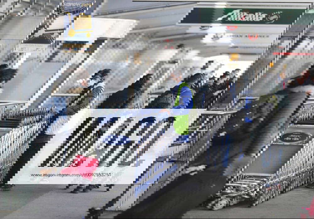 (200314) NEW YORK, March 14, 2020 A staff worker moves luggage