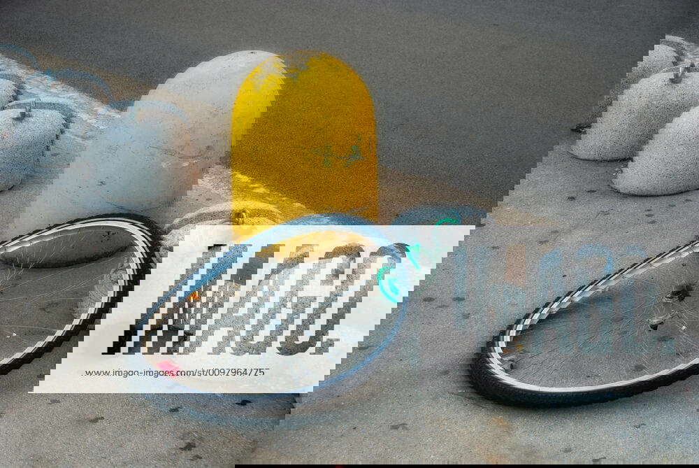 Stolen Bicycle Remaining Wheel of a stolen Bicycle in a Italian Square