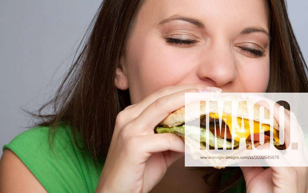 Girl Eating Food Beautiful girl eating hamburger food Y