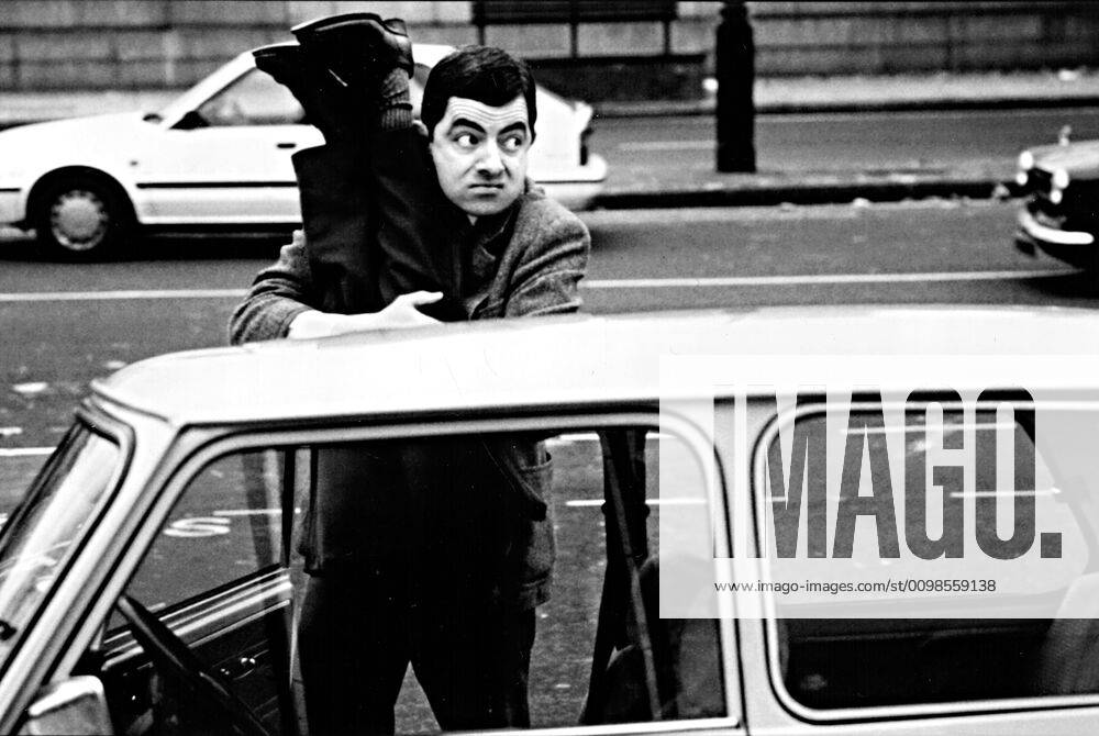 BEAN, Rowan Atkinson, getting into his green Mini car, 1997 ...