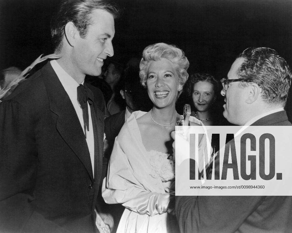 From Left Husband And Wife Stars George Montgomery And Dinah Shore Interviewed At The Premiere Of T