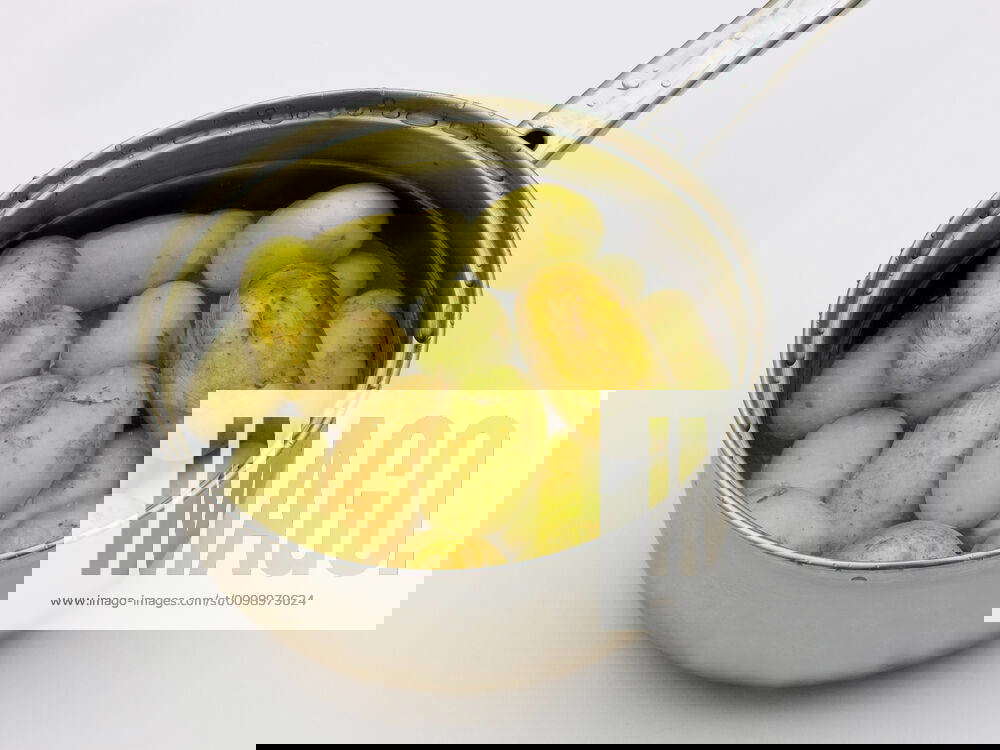 Boiled potatoes in pan Scrubbed potatoes with skin for healthy eating