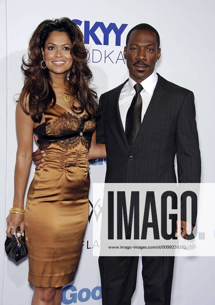 Tracey Edmonds (wearing a Roberto Cavalli dress), Eddie Murphy at ...