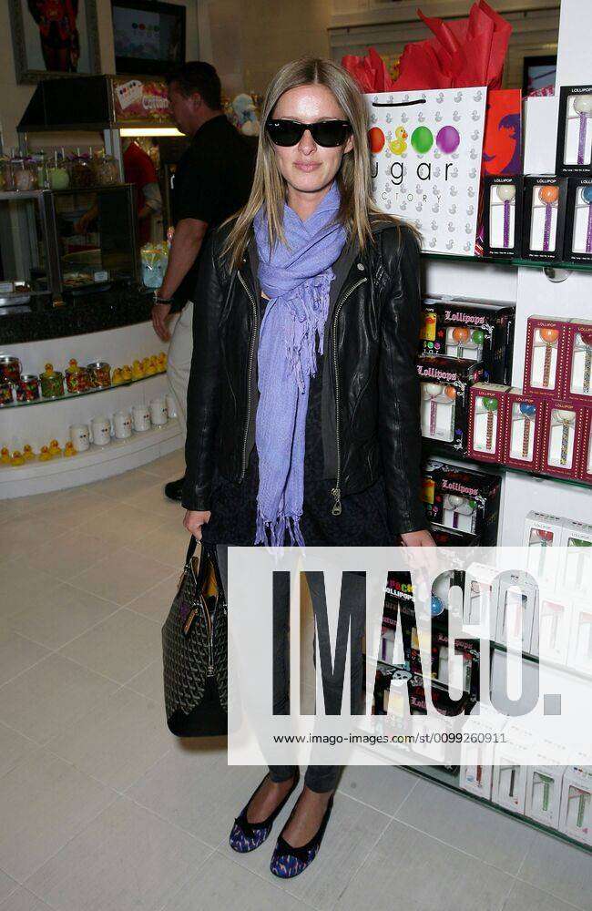 Nicky Hilton (carrying a Goyard bag) at a public appearance for