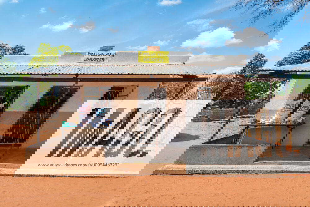 Front exterior of local grocery store located in Mukuni Village with blues skies up above, Zambia