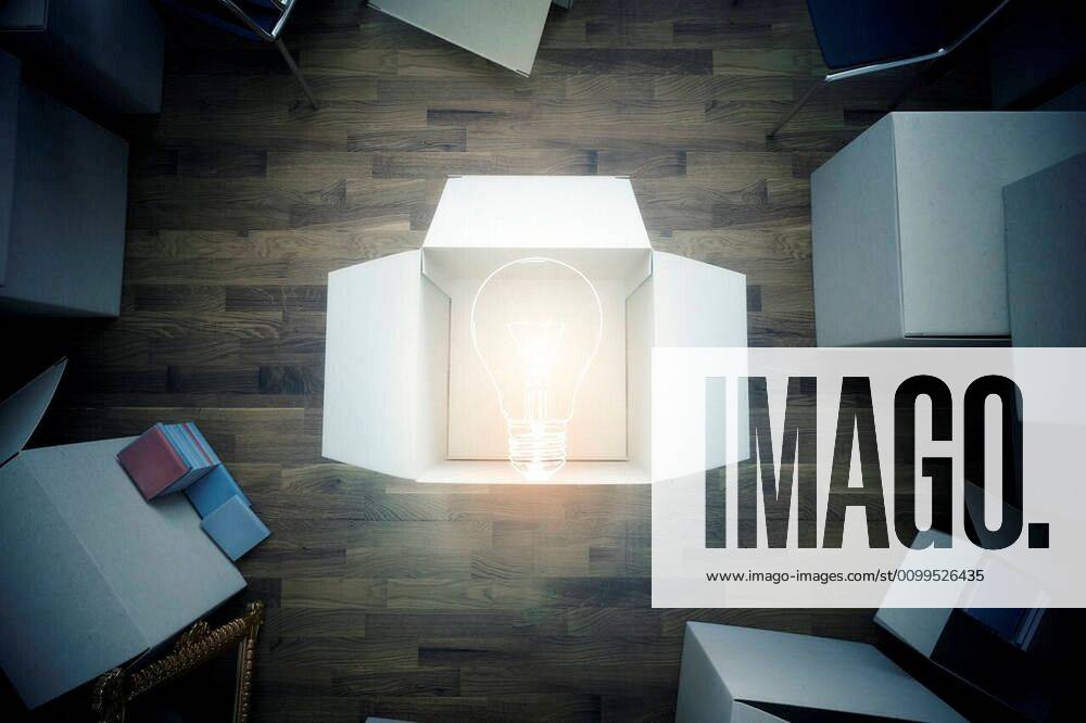 Top view of room with cardboard boxes and abstract light bulb. Idea