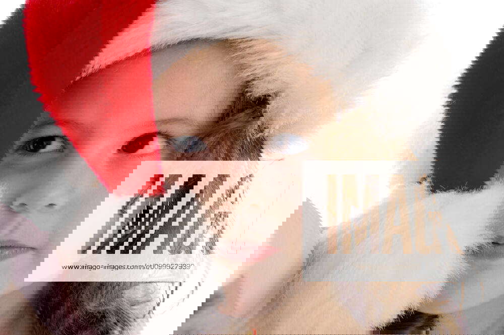 Little girl wearing christmas hat cute little girl wearing christmas hat