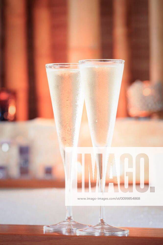 Two glasses of champagne near jacuzzi. Valentines background. Romance