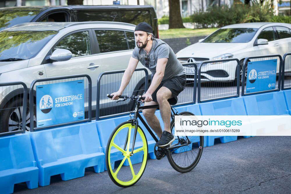 Streetspace Car Free Zone London A cyclist cycles down the pop up