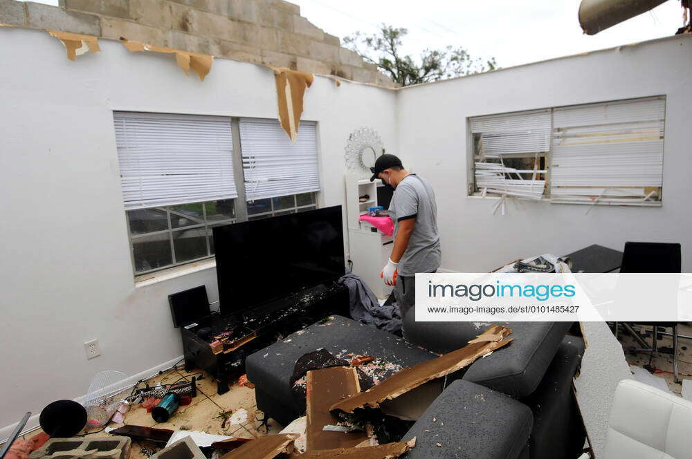 Orlando, Florida, United States: Jose Pico picks up items from his ...