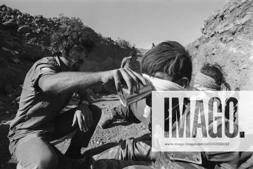Syrian prisoners on the Golan Heights are given water to drink during