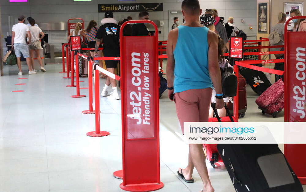 Coronavirus Sun Aug 2, 2020 A group of travellers returning to the UK queue at the Jet2 checkin