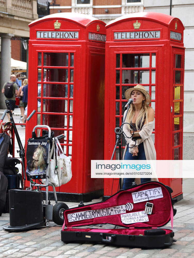 August 22, 2020, London, United Kingdom: Female busker performs in ...