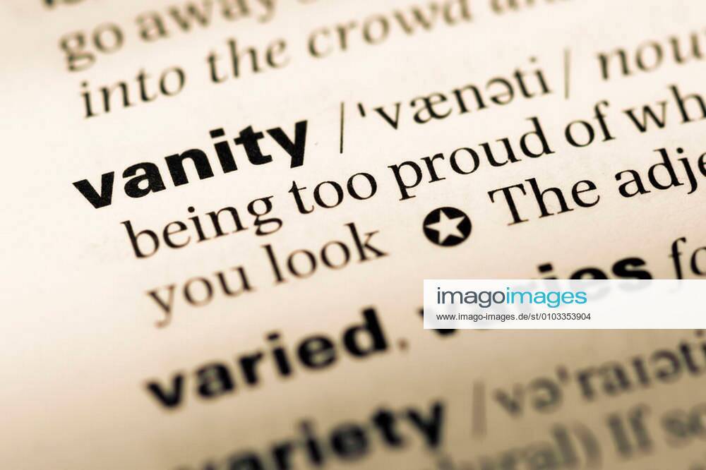 Close up of old English dictionary page with word vanity