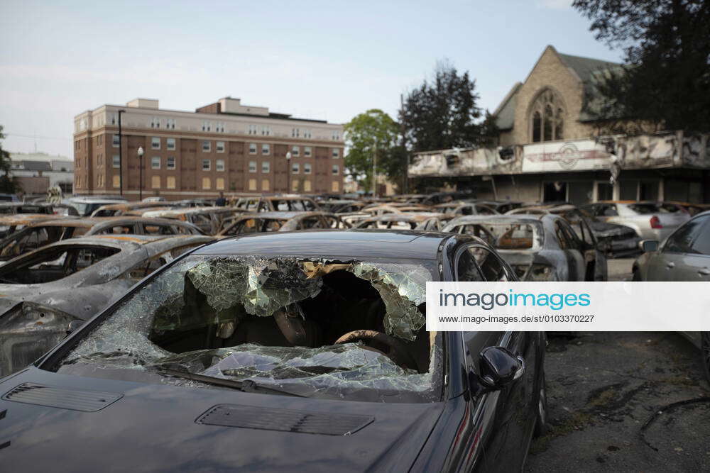 August 24, 2020: A small car lot in Kenosha, WI sits full of burne out ...