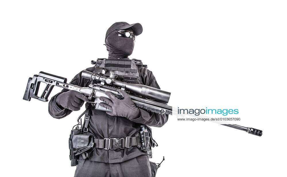 Studio shot of SWAT police special forces with pistol hiding