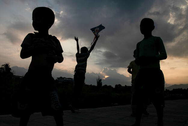 October 11, 2020, Kathmandu, Nepal: A silhouette of a kid flying a kite ...