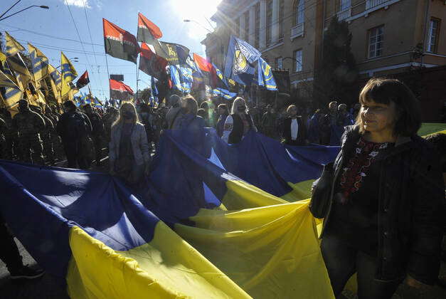 Kiev, Ukraine: Activists marching with a huge Ukrainian flag during the ...