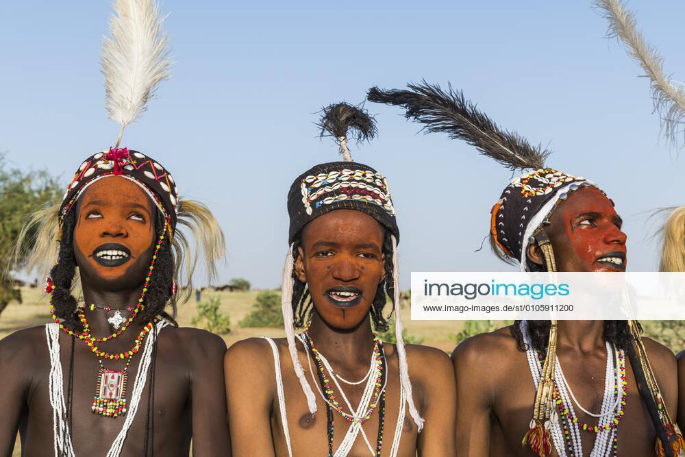 Wodaabe Bororo men with painted faces, necklace and headdress