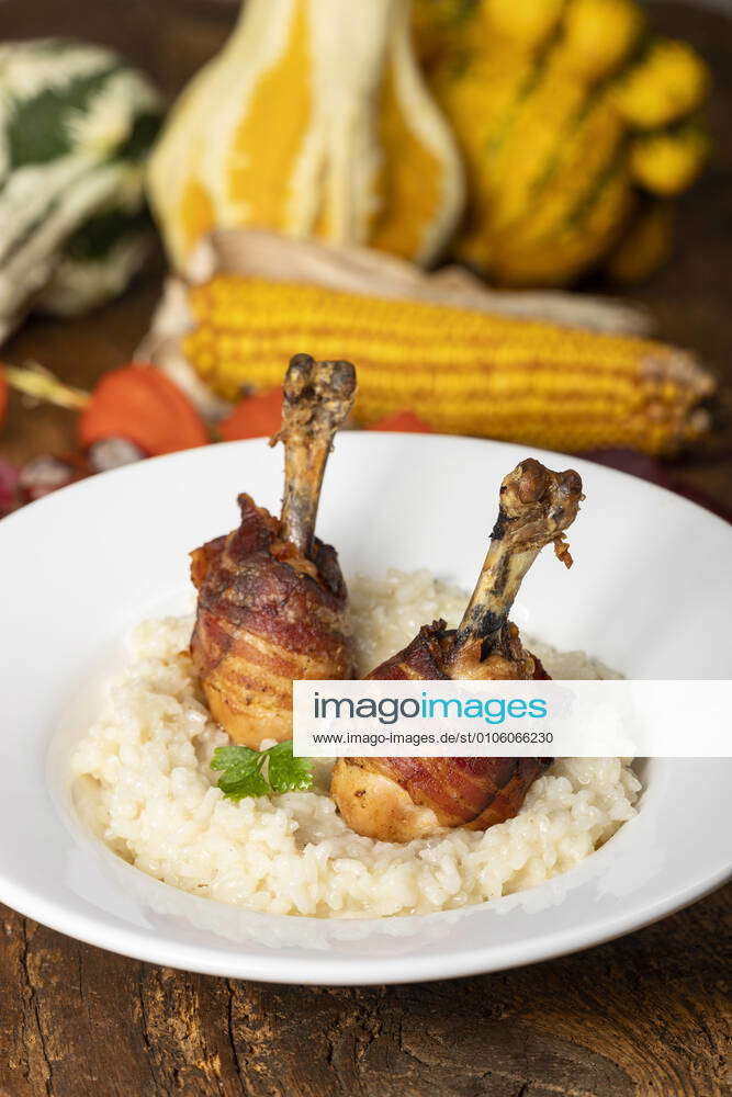 Chicken legs with bacon on risotto