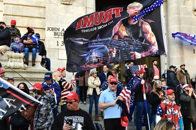 Maga Sign Rally People attending the pro-Trump MAGA rally on the steps of the John A ...