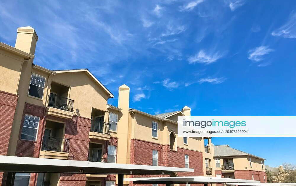 Lew angle view typical apartment building complex with covered parking