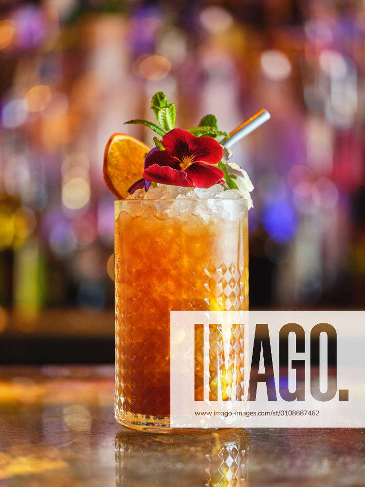 Cocktail decorated with fruits and flower