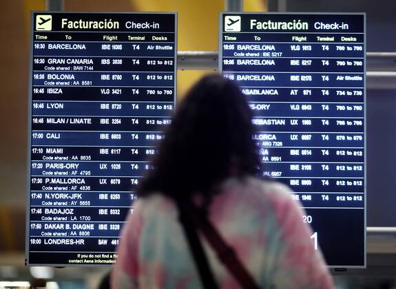 Passengers at Terminal T4 at Adolfo Suarez Madrid-Barajas Airport, one ...