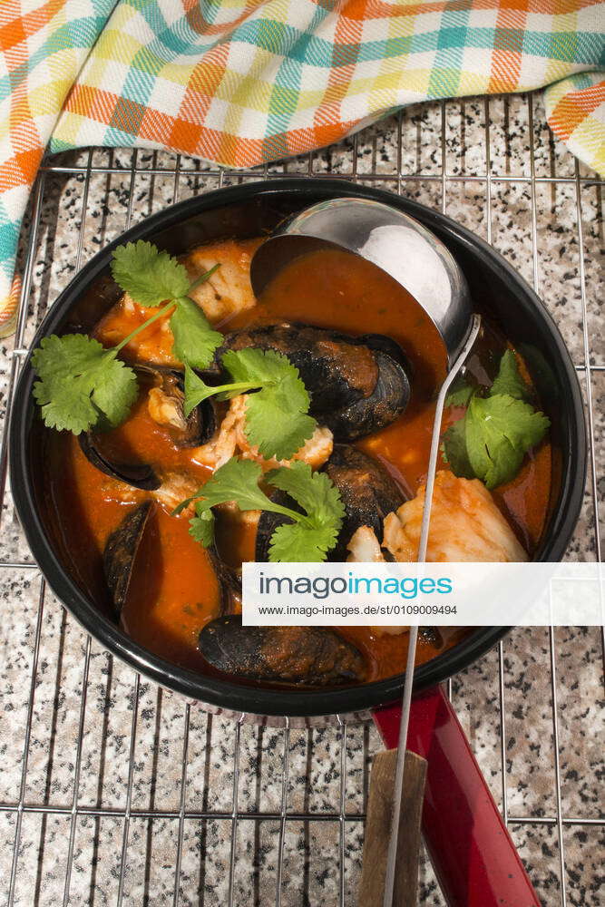 Mussels and cod in tomato sauce mussels, cod and tomato soup in