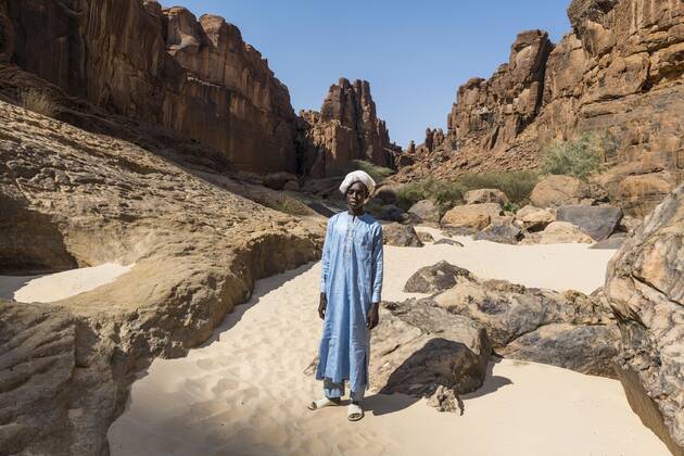 Young Bedouin in the waterhole of Guelta d Archei, Unesco site Ennedi ...