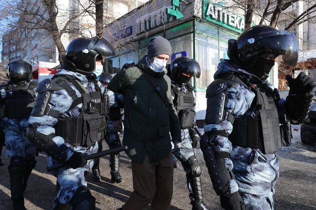 Russian Riot Tactics MOSCOW, RUSSIA — : Riot police detain a demonstrator as supporters of ...