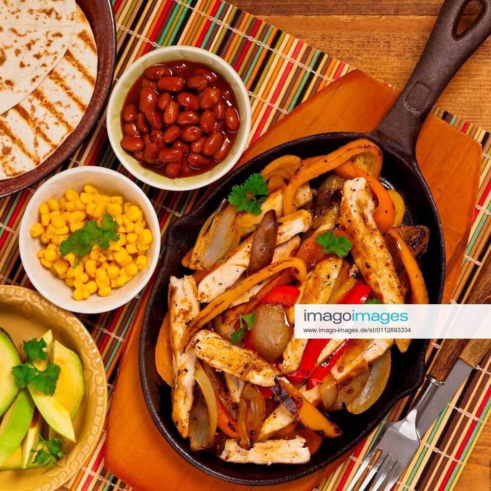 Chicken Fajitas with Grilled Onions and Bell Peppers serve with