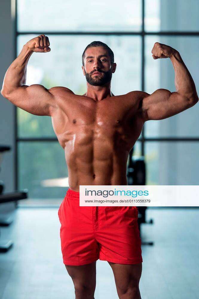 Bodybuilder Performing Front Double Biceps Pose Stock Photo, Picture and  Royalty Free Image. Image 27221300.